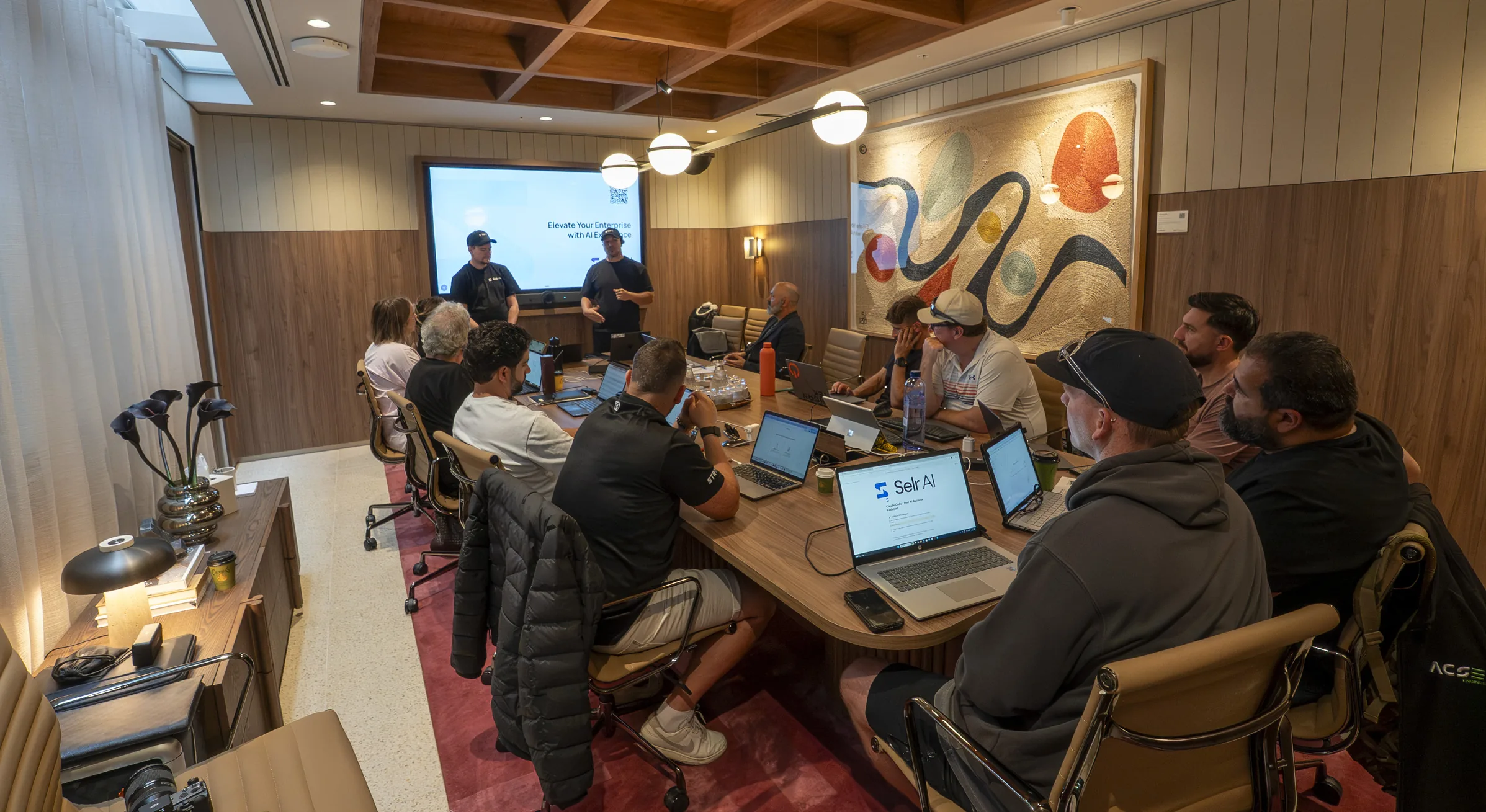 A Selr AI workshop session with attendees working on laptops