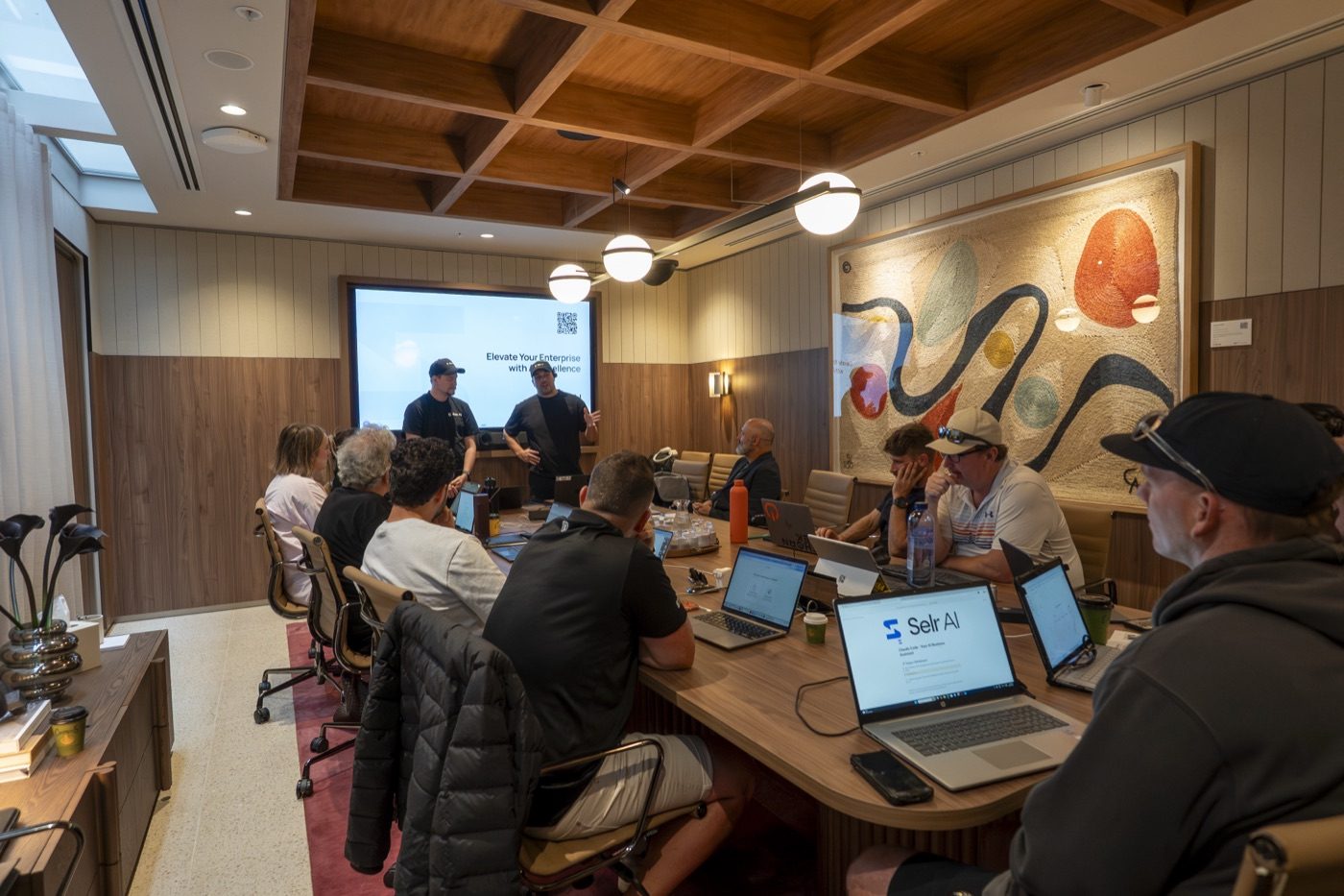 An AI Install Day room, laptops open